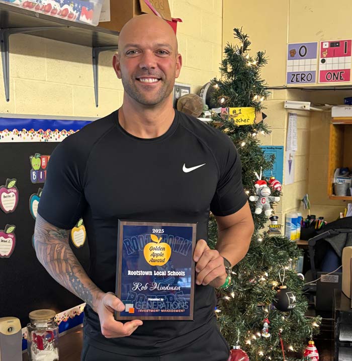 Hindman-Golden-Apple Rob Hindman holds his 2025 Golden Apple award